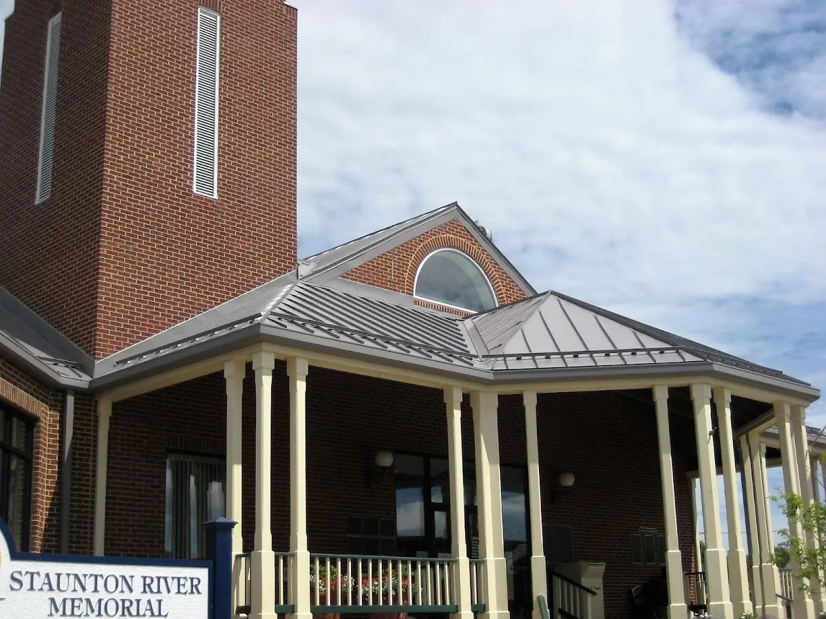 Skilled roofing craftsmen working on a residential roof in Settlers Landing